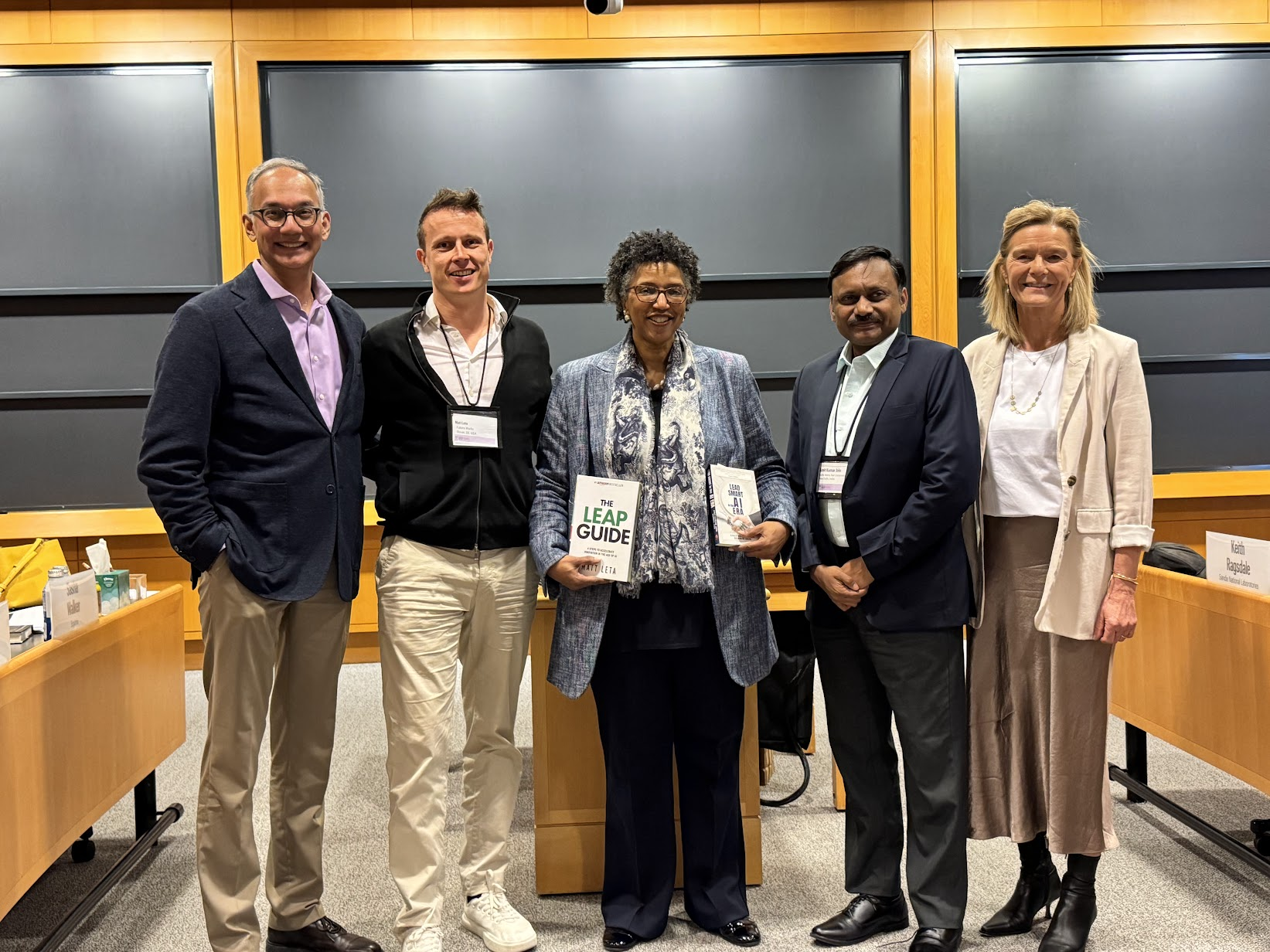 Matt Leta with group at Harvard holding The LEAP Guide book